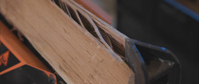 SotaFlame video showing real wood logs being hand-crafted, cut, stacked, and lit inside a cozy burning fireplace.